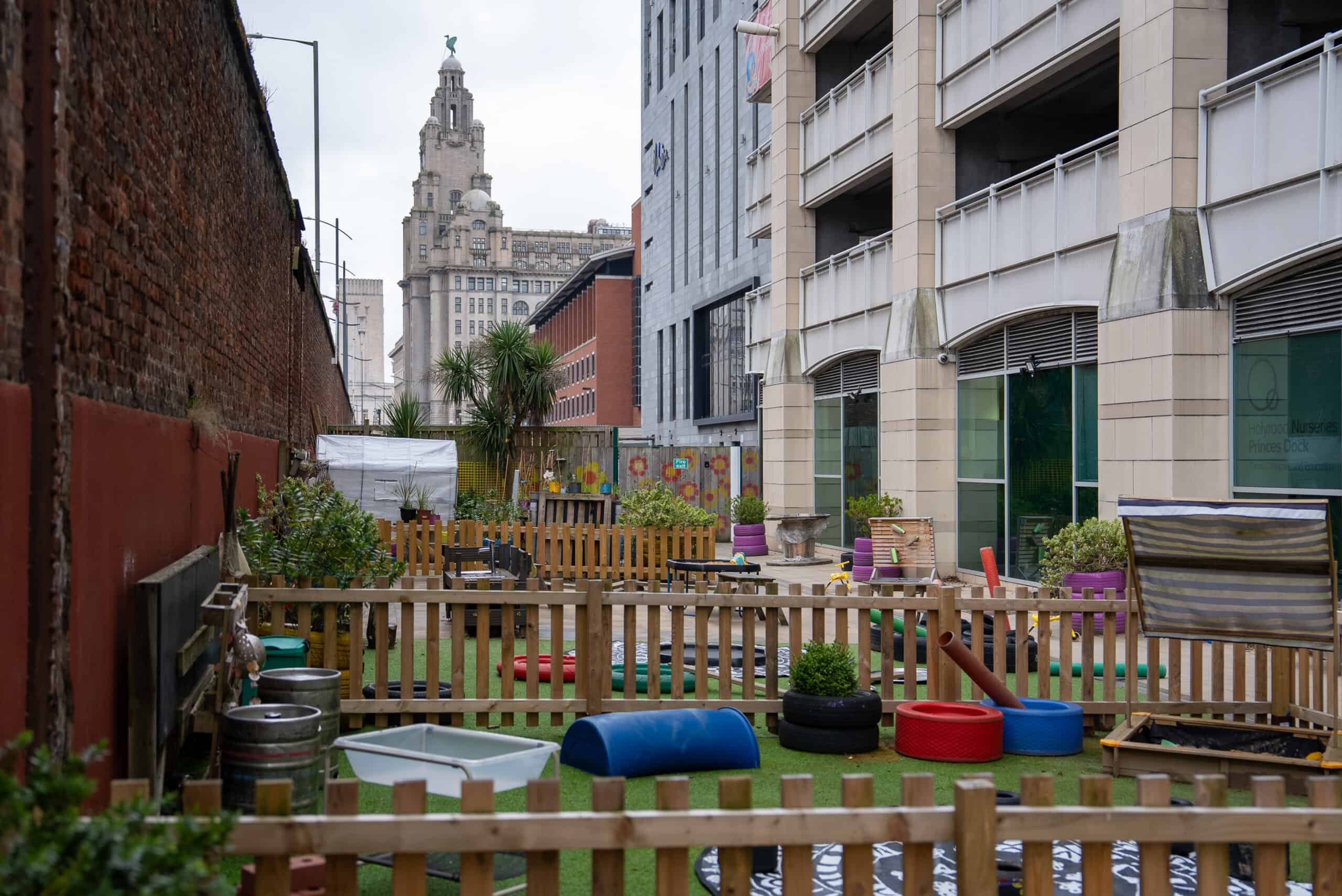 Outdoor play space at Holyrood Nursery Princes Dock featuring vibrant toys, safe fencing, and a welcoming environment for children's outdoor activities.