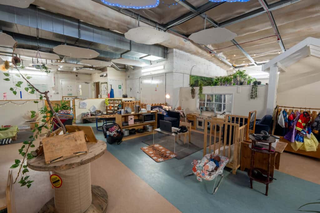 Bright indoor play area at Holyrood Nursery Princes Dock, featuring toys, books, and child-friendly furniture for early childhood development.