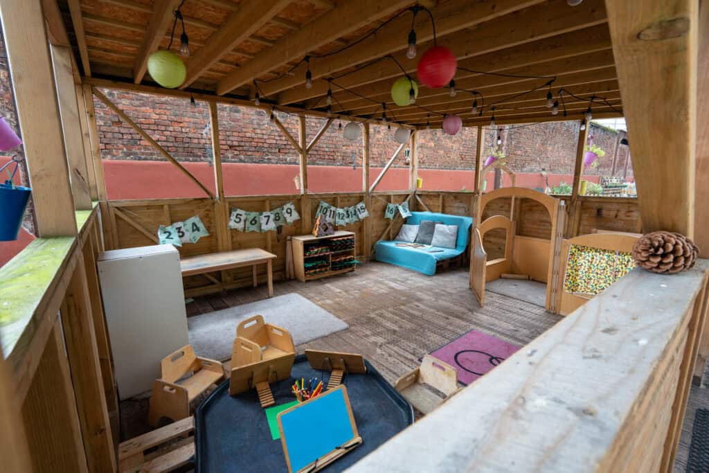 Bright and inviting outdoor nursery play area at Holyrood Nursery Princes Dock, designed for early childhood development and outdoor learning.