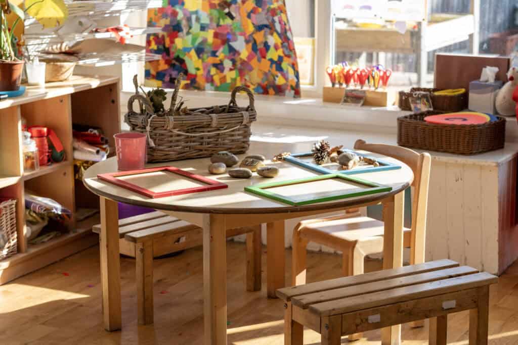 Bright, inviting classroom at Thrive Childcare with natural light, creative centrepieces, and educational materials supporting early childhood development in a friendly, nurturing environment.