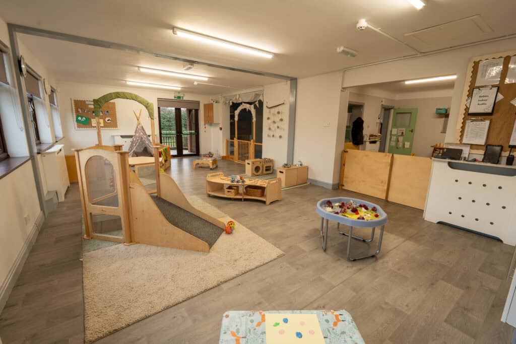 Bright and welcoming indoor play area at Thrive Grosvenor House childcare, featuring soft play equipment, toys, and engaging activities for young children.