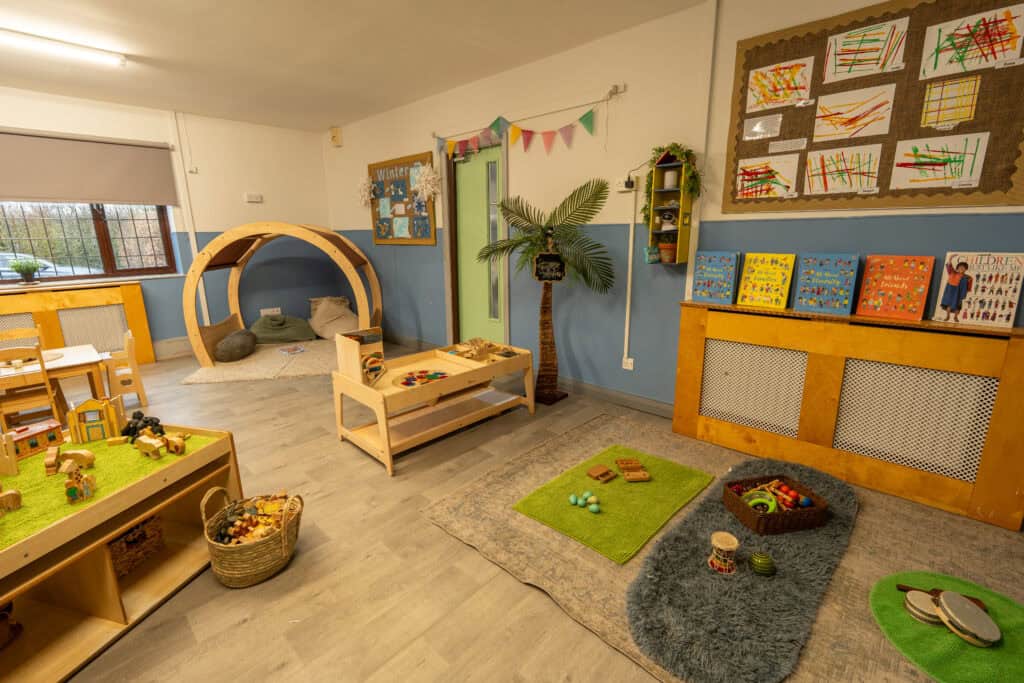 Childcare room at Thrive Grosvenor House featuring engaging activities and creative displays for young children.