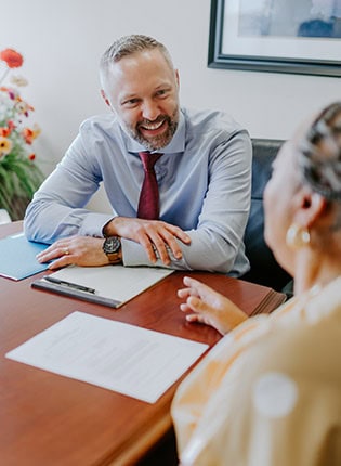 Experienced personal injury attorney consulting with a client at Tuley Law Office, providing legal advice and support for injury claims and legal solutions.
