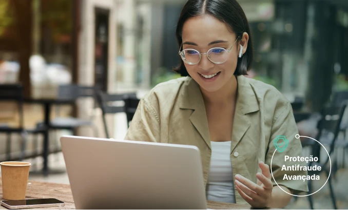 a hand holding a phone with a screen showing a picture of clothes