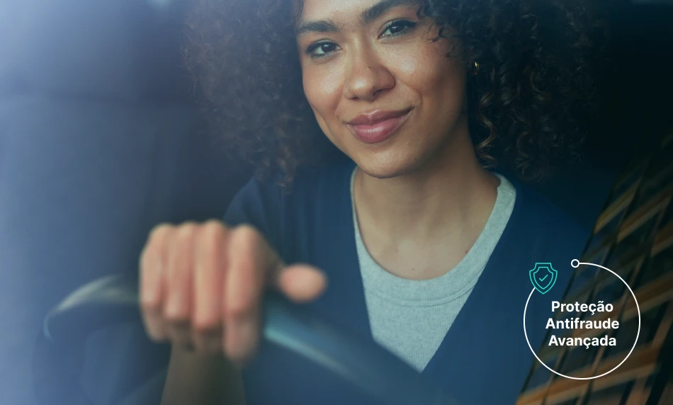 a hand holding a phone with a screen showing a picture of clothes