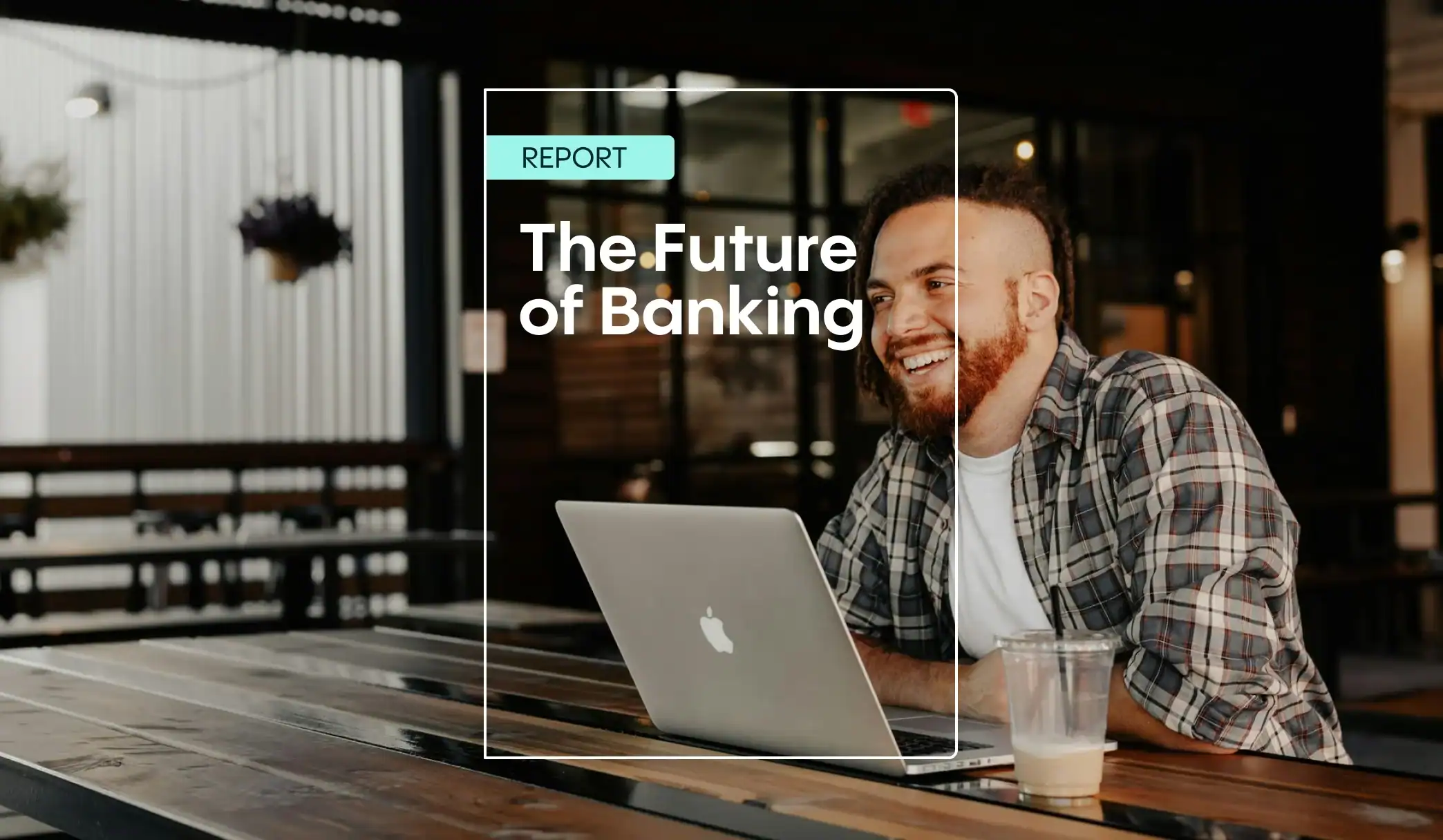 Person working on laptop at café.