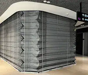 Deployed grey fire curtains in transit hub