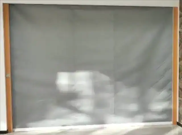 Fire curtains deployed to form a fire-resistant barrier in an open-plan building