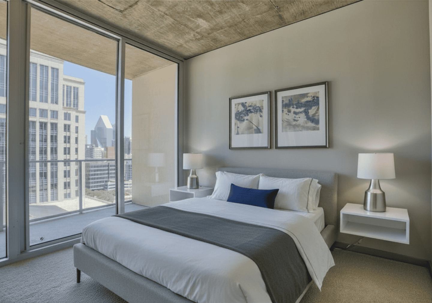 Spacious bedroom with large windows at Glass House Dallas, Texas