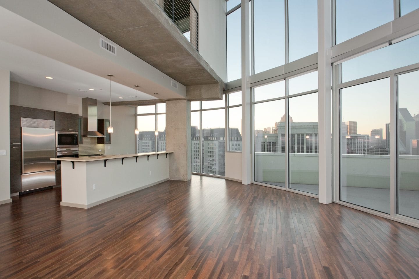 Contemporary kitchen with stainless steel appliances at Glass House Dallas, Texas