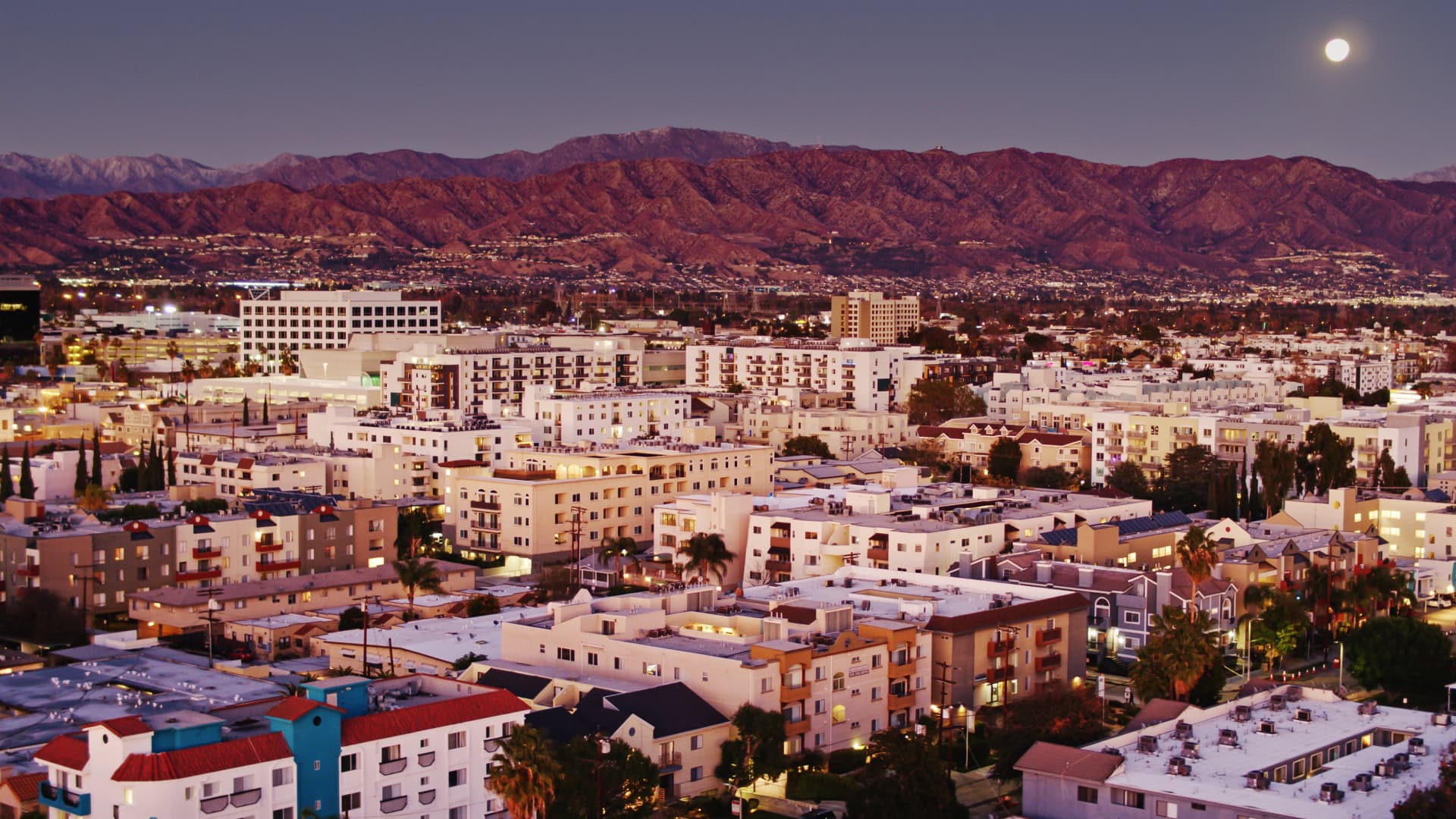 Aerial shot of mid-rise buildings in North Hollywood at sunset. Airspace authorization has been obtained from the FAA for this operation.
