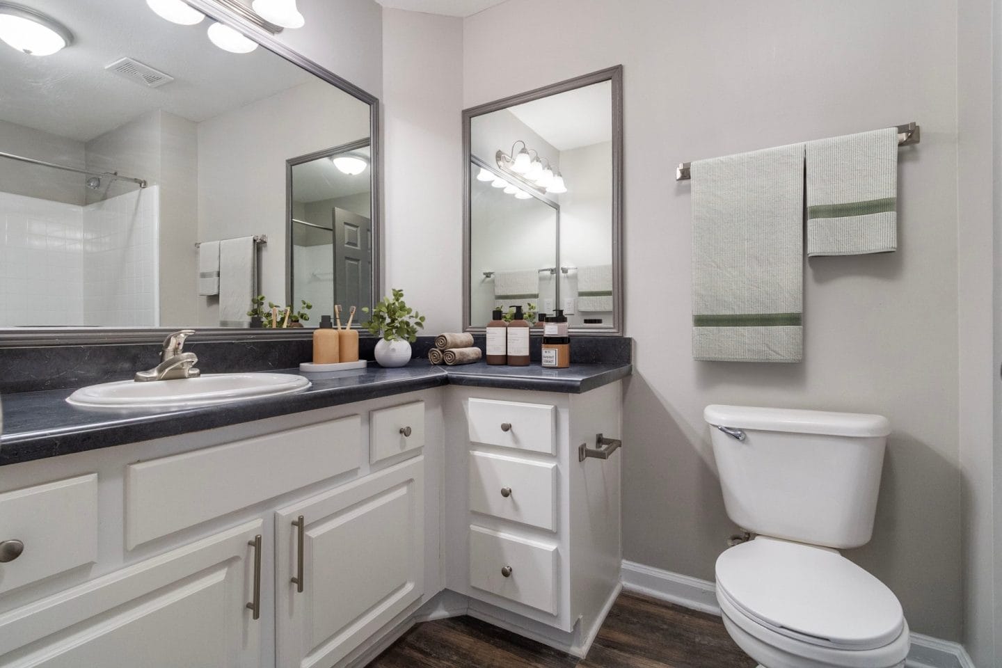 Bathroom with vanity, mirror lighting, and toilet at Windsor Kennesaw, 1925 Old 41 Highway Northwest, Kennesaw, GA 30152