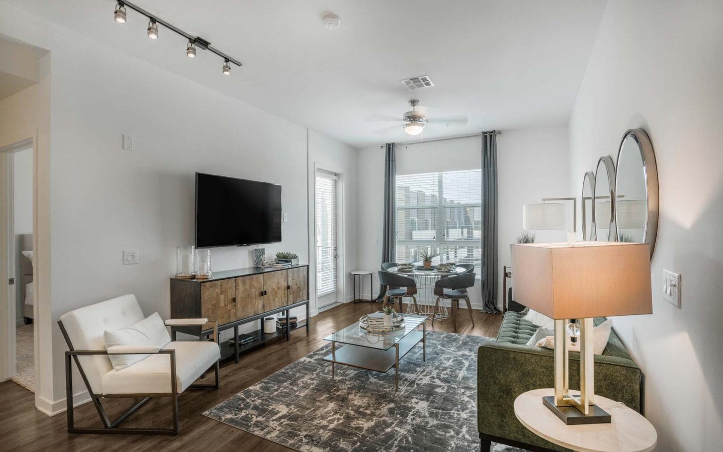 Spacious living room with natural light at Windsor Mission Valley, 5080 Camino Del Arroyo San Diego, CA 92108
