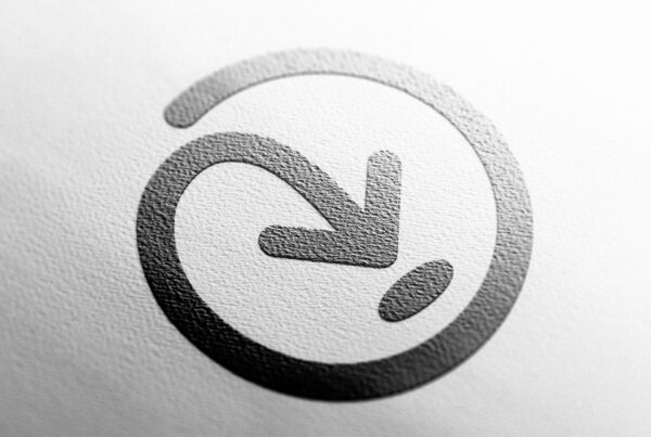 A black and white Addressfinder icon with an arrow on it.