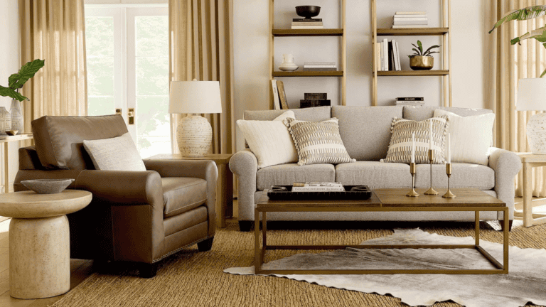 An arm chair and a sofa in a living room