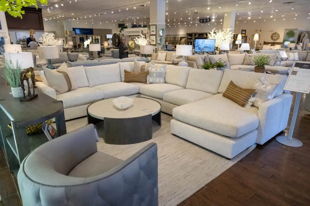 Elegant, neutral-toned sectional with plush cushions, perfect for a versatile and evolving home environment.