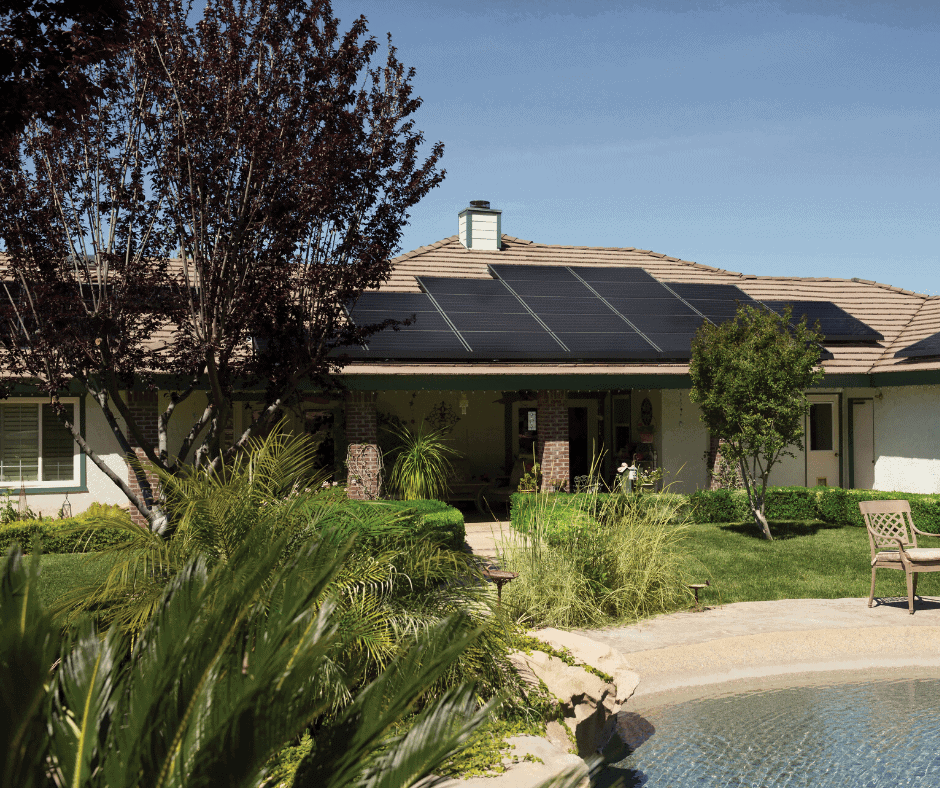 Single family home with a pool and plants in their backyard, and solar panels on their roof in relation to Maryland's solar roof panel architectural laws.