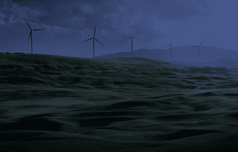 Wind turbines in an open field showcasing YVSM's environmental, natural resources and sustainability practice area.