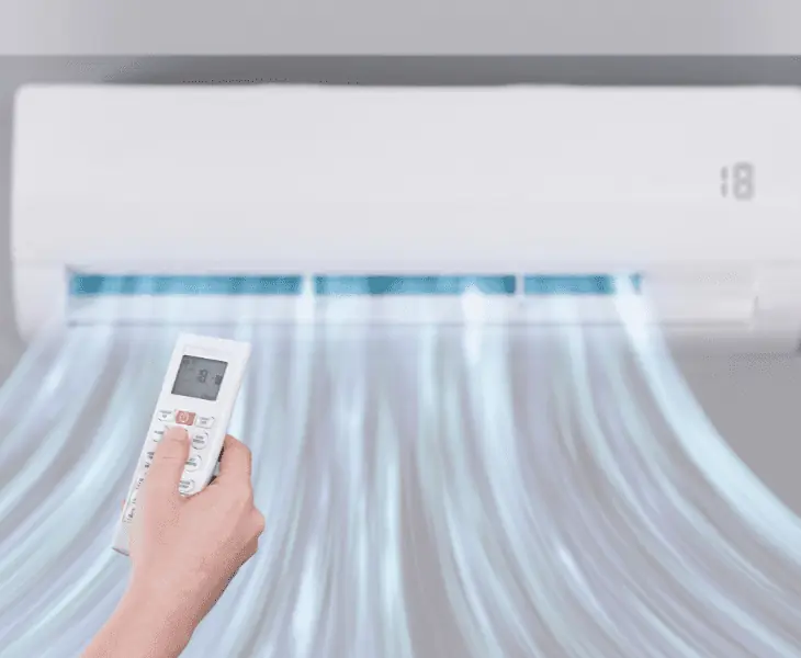 man controlling heat using ac