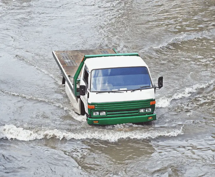 never drive through flooded roads