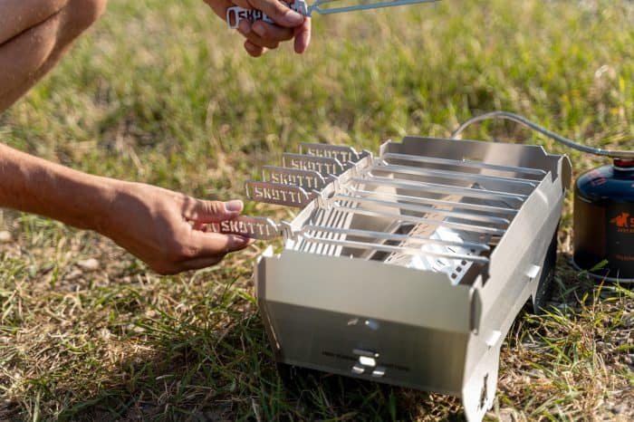 Portable Skotti Pikes camping grill for outdoor cooking and grilling.