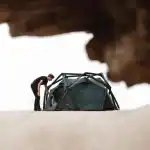 Portable camping tent with camouflage design for outdoor adventures.