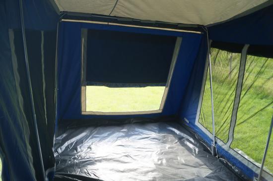 Spacious trailer tent with awning for camping comfort and outdoor adventures.