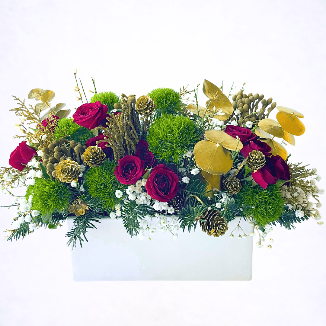 Luxury Christmas centerpiece with red roses and evergreen textures