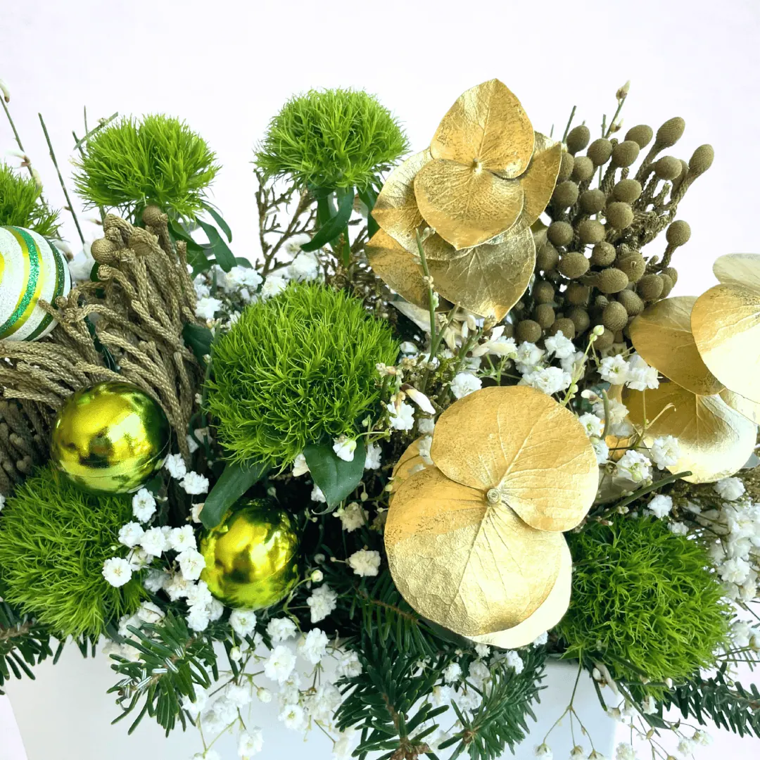 Luxury Christmas evergreen centerpiece with gold holiday accents