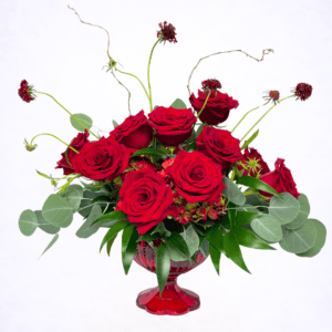 Luxury sculptural red rose arrangement in pedestal glass vase