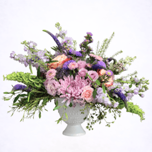 Luxury lavender garden style flower arrangement in white pedestal vase