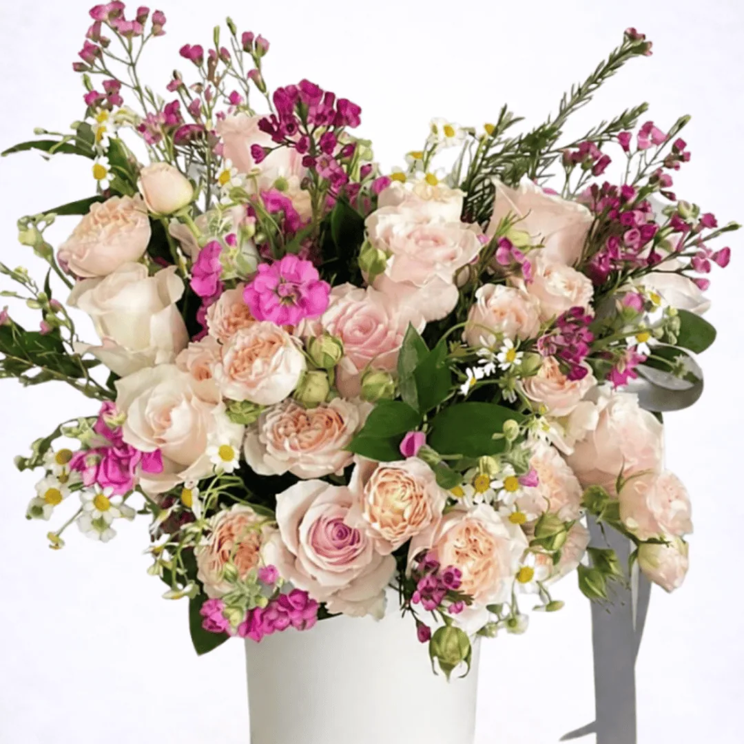 Luxury blush garden-style flower arrangement with roses and spray roses