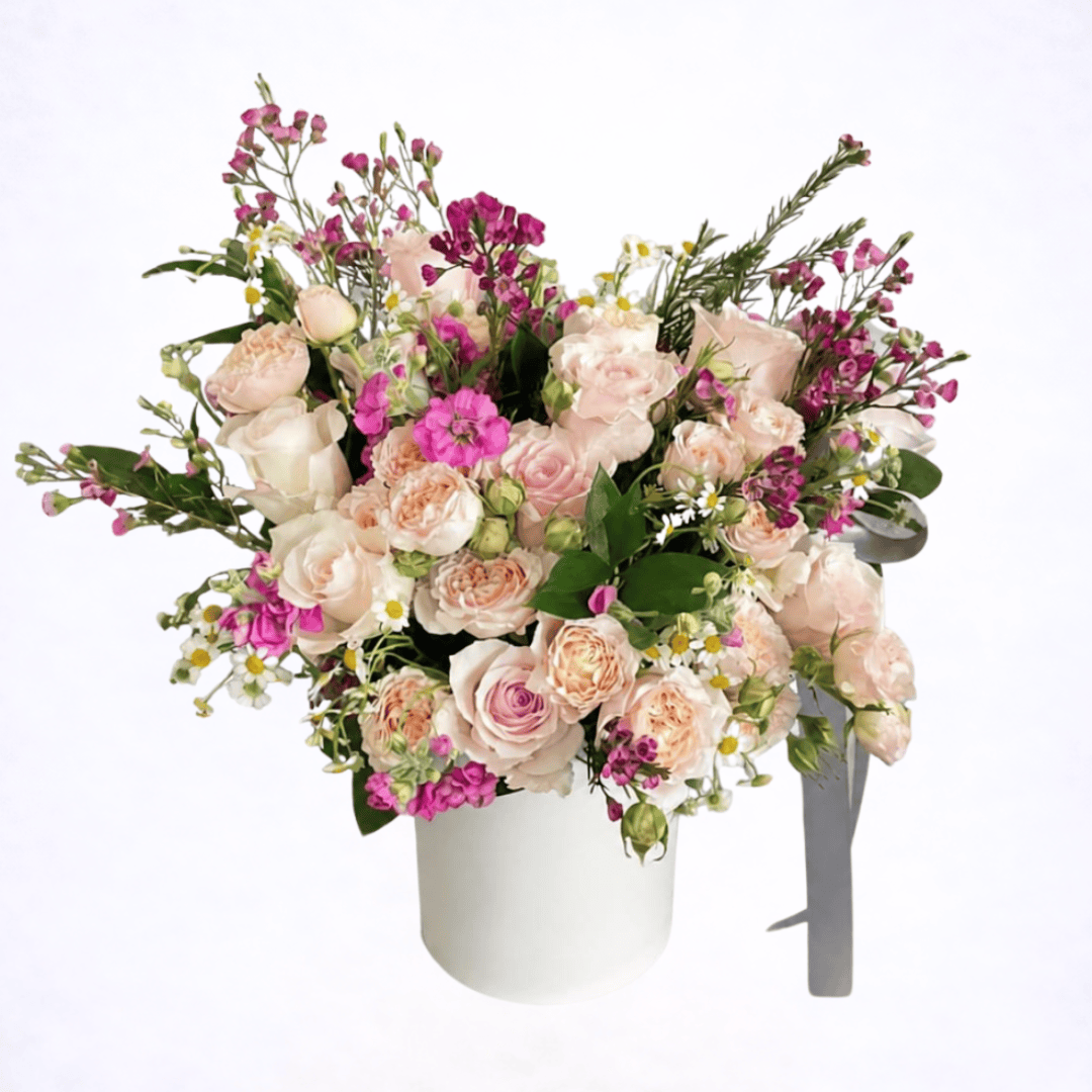 Luxury blush garden-style flower arrangement with roses and spray roses