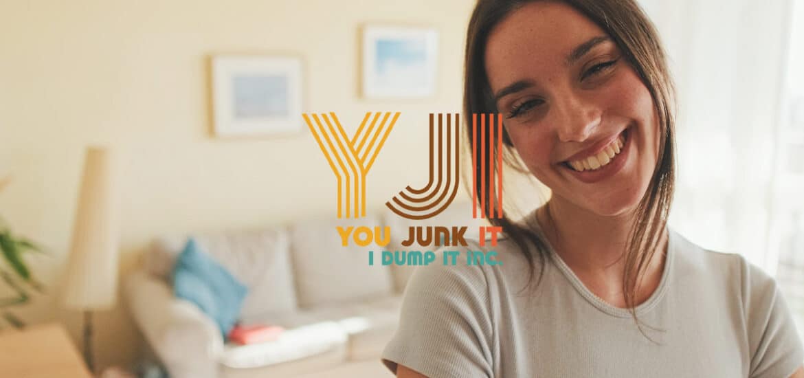 Junk removal service professional smiling in home setting with You Junk It logo.