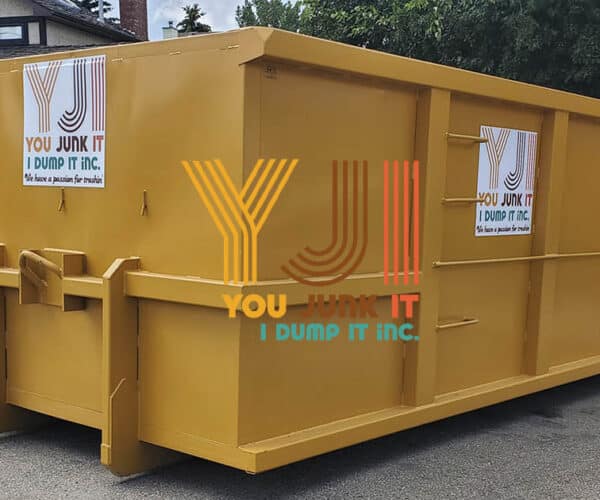 Used industrial dumpster in yellow for waste disposal by You Junk It I Dump It.