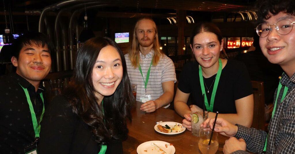 Young Canadians for Resources: YCR networking event with diverse youth at a restaurant, promoting resource industry engagement in Canada.