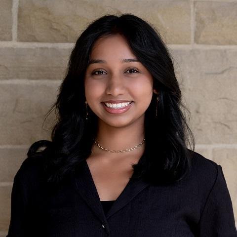 Bright young woman representing Young Canadians for Resources at a professional event.