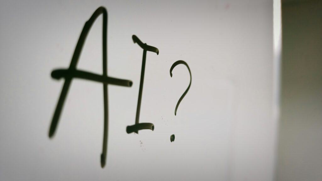 Alternative text: Metal hooks forming the letters "A" and "?" on a white background.