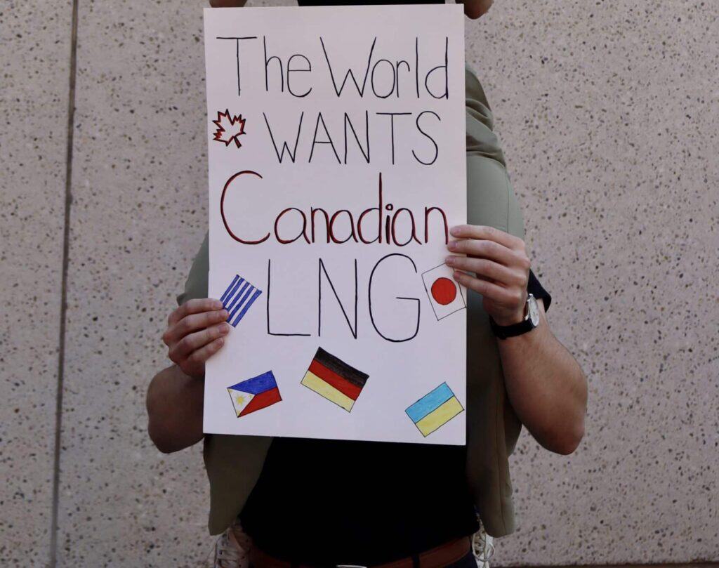 Canadian flag protest sign for resource development, advocacy for Canadian interests and policies.