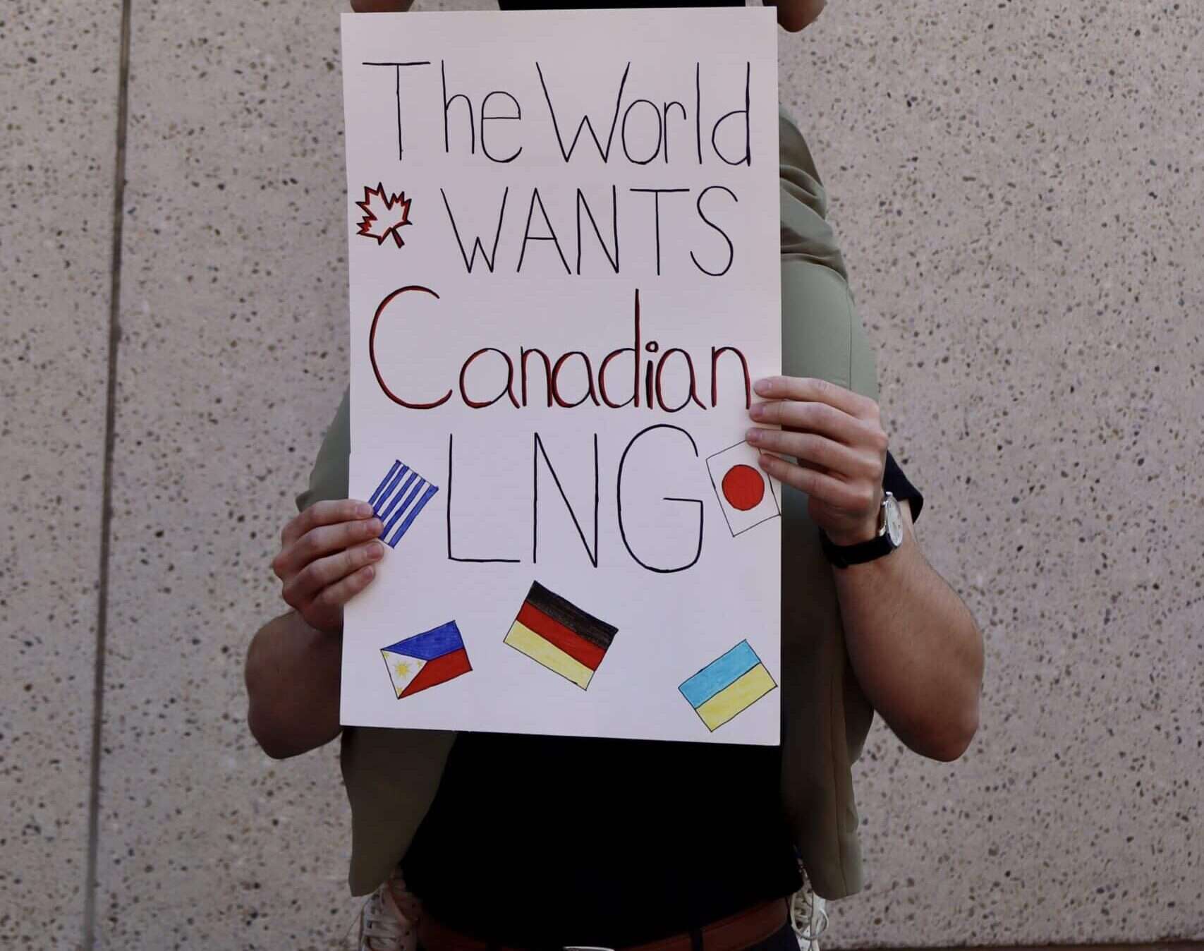 Canadian flag protest sign for resource development, advocacy for Canadian interests and policies.