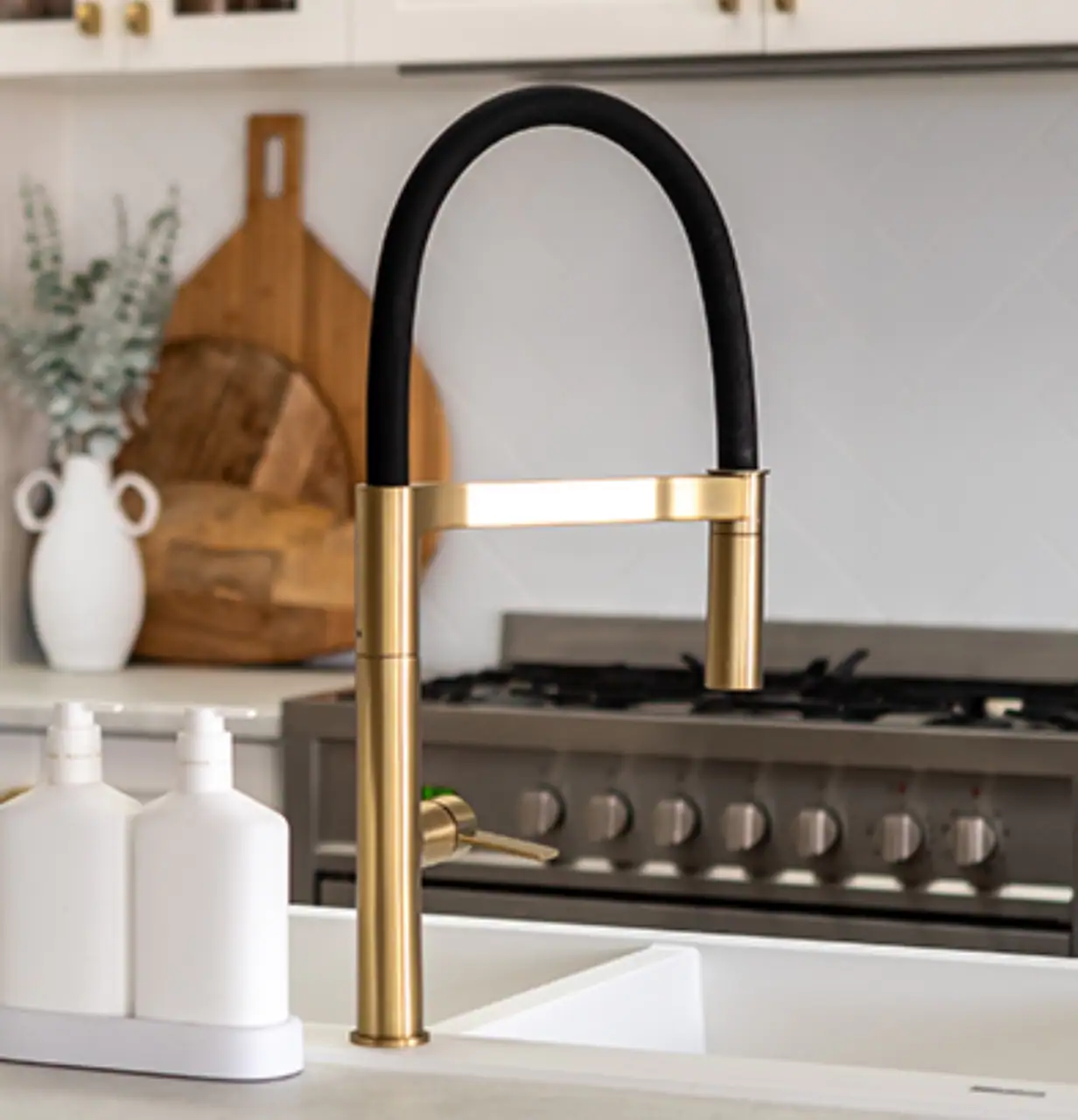 High-quality kitchen sink with stylish black and gold faucet, ideal for professional plumbing and ki.