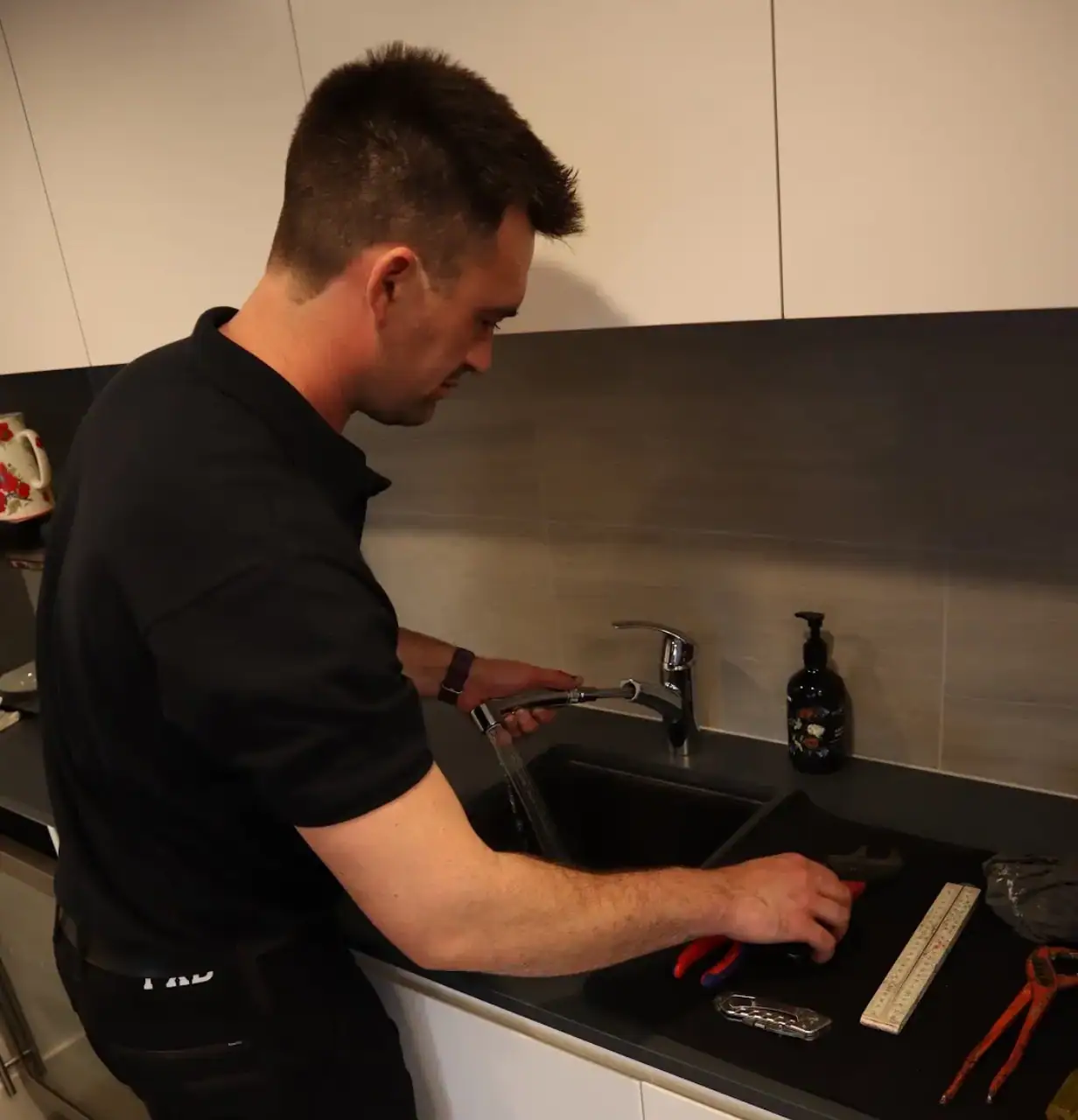 A licensed plumber using a professional tool to unblock a toilet.