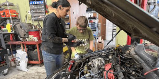 Technicians inspecting car engine at 360 Auto AZ workshop.