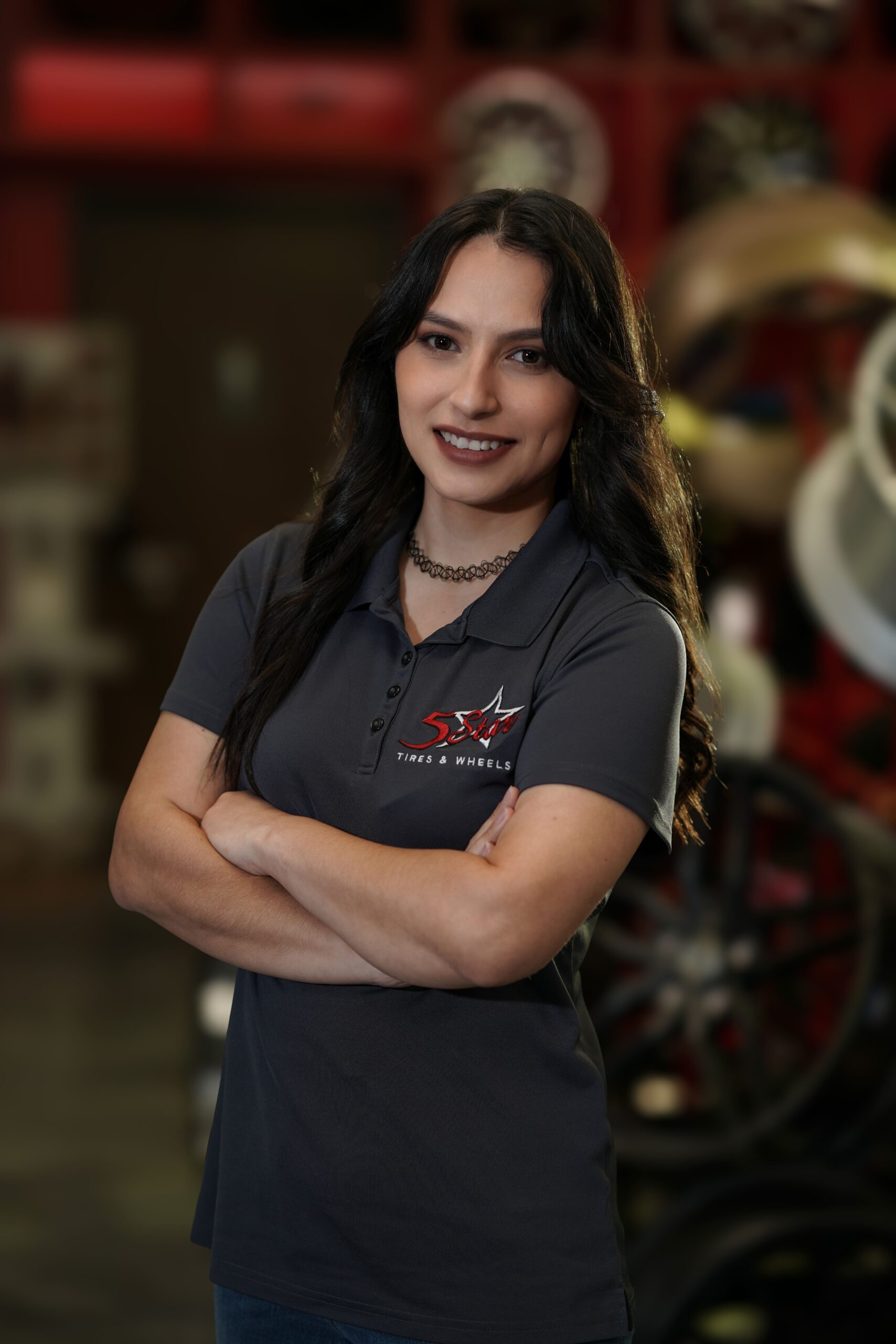 Friendly female staff member at 5 Star Tires and Wheels store.