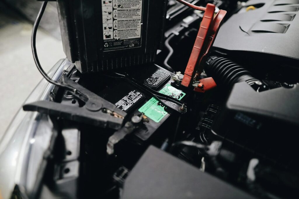 Car battery being checked during maintenance at 770 Auto Service.