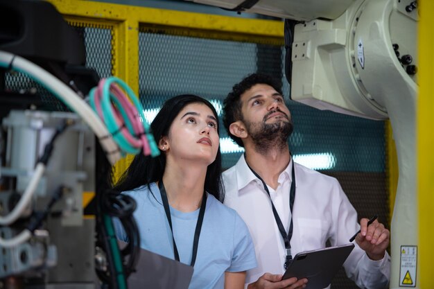 technicians-are-introducing-industrial-hand-robots-businessperson-factory-industry