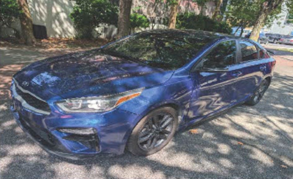 Blue sedan parked outdoors, ready for auto service or repair.