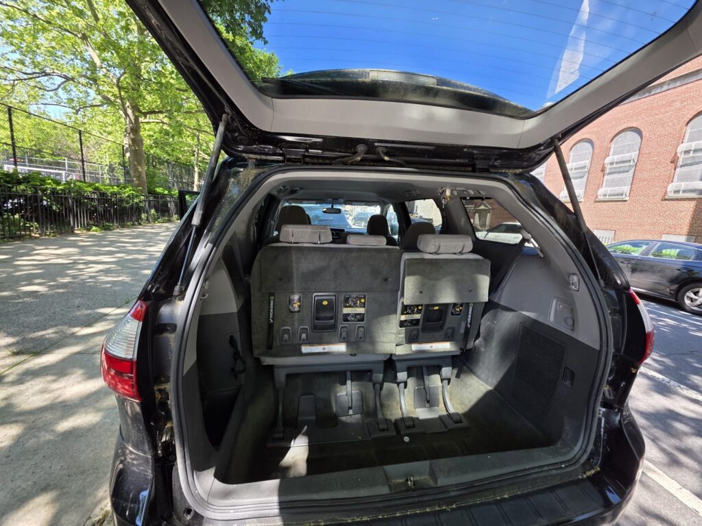Rear cargo space of Toyota RAV4 with seats folded for increased storage capacity.