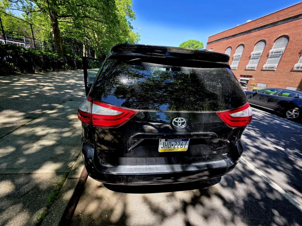 Toyota SUV rear view with license plate JHD-2267 parked outside.