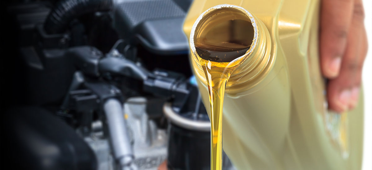 Pouring transmission fluid into engine